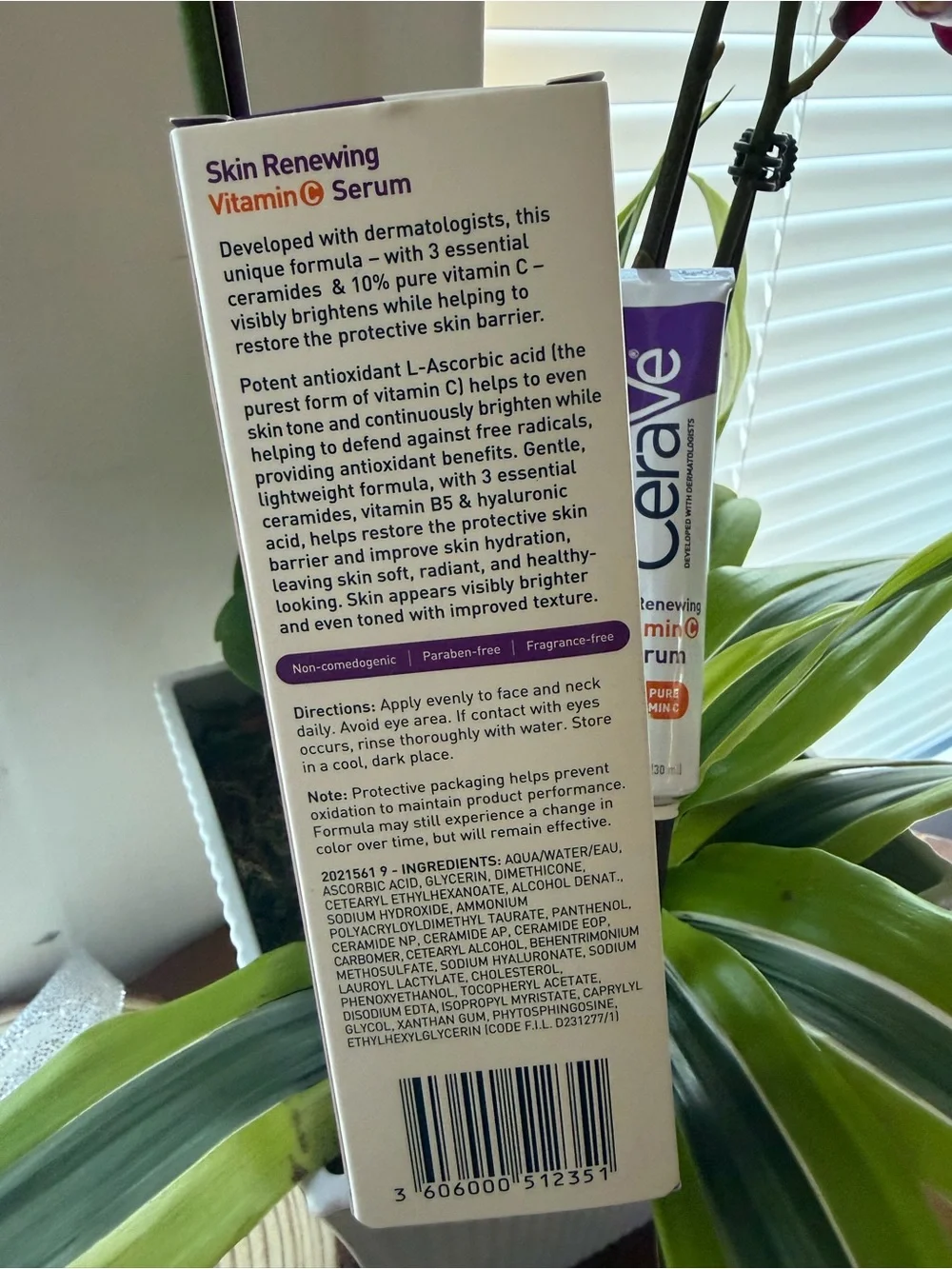 rave Vitamin C Serum Tube and Box in White and Purple
